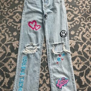 Women's Light Blue Jeans with Graphic Patches